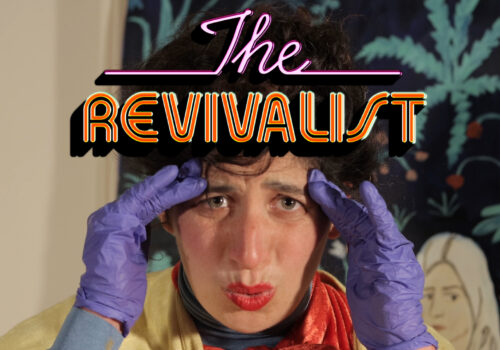 Text in retro lilac and orange lettering reads: The Revivalist. The text is laid over the image of the face of a woman wearing red lipstick. The woman holds a theatrical facial expression. She is wearing purple gloves and uses her hands animatedly.
