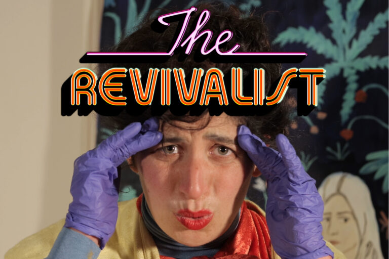Text in retro lilac and orange lettering reads: The Revivalist. The text is laid over the image of the face of a woman wearing red lipstick. The woman holds a theatrical facial expression. She is wearing purple gloves and uses her hands animatedly.