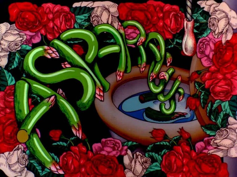 Colourful animations of pink and red roses completely surrounding a toilet bowl. Two pieces of asparagus are floating in the toilet and the word 'Asparagus' stretches across the images, animated from the vegetable itself