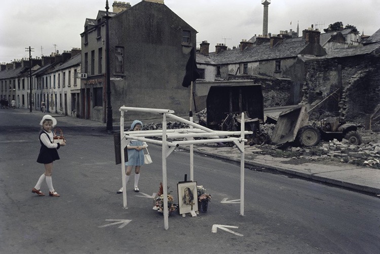 Street memorial on Lecky Road, Derry city, 1971, marking the site where Desmond Beattie (19 years old) was shot and killed on 8 July 1971by the British Army. Seamus Cusack (28 years old) was shot dead near this spot about twelve hours later. These men were the first people shot dead by the British Army in Derry. © Estate of Akihiko Okamura