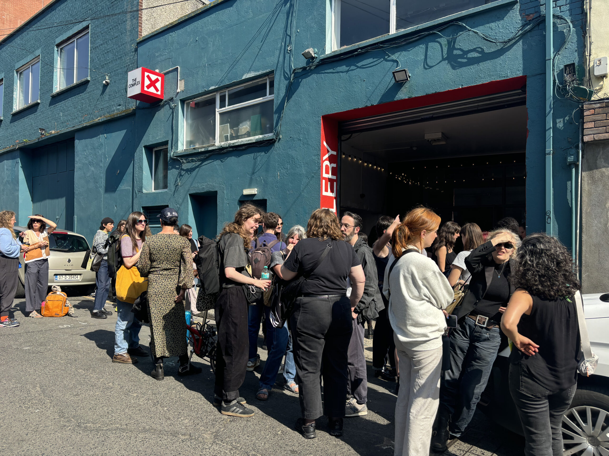 artists gather outside the 16mm workshop at The Complex